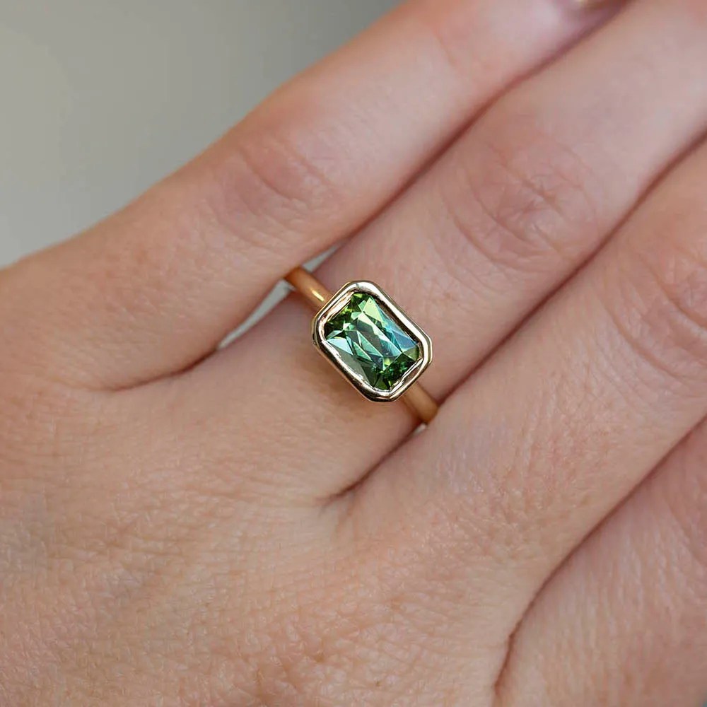 1.41ct Radiant Cut Green Tourmaline East-West Bezel Set In 14k Yellow Gold