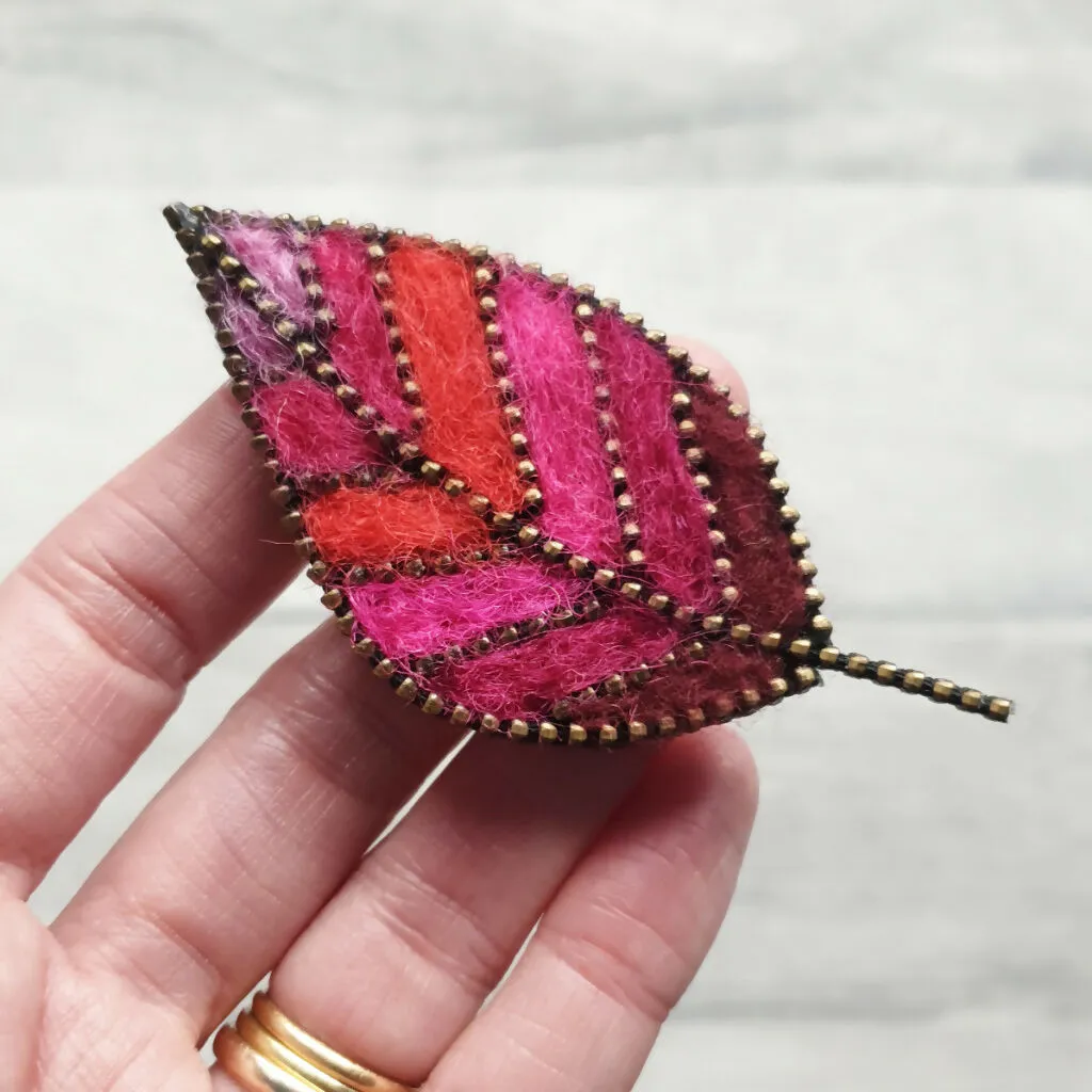 Hand Felted Leaf Brooch With Zip Edge Detail - Hot Pink and Reds